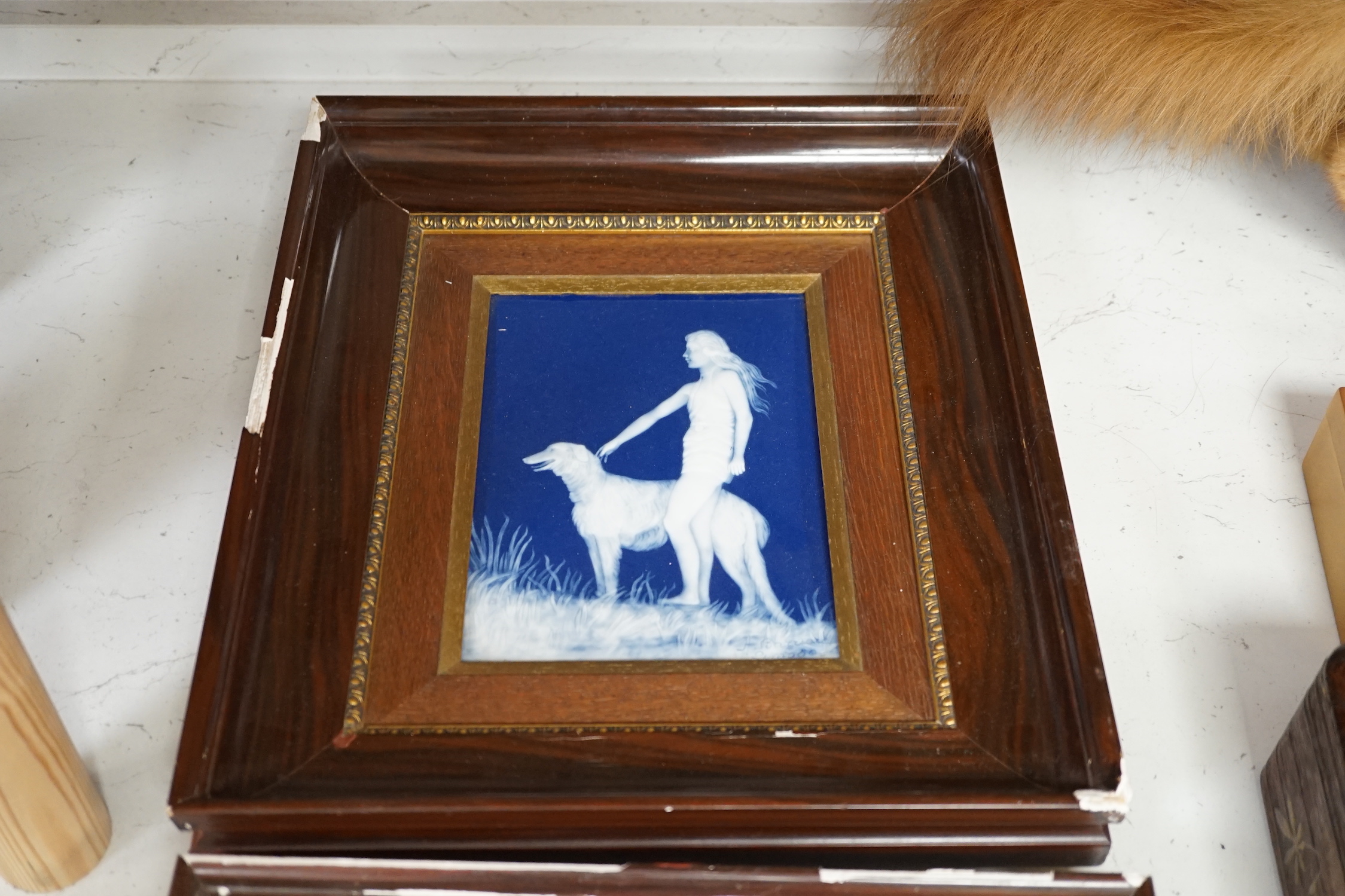Two Limoges pate sur pate plaques, dancing female and female with a dog, each signed A. Barriere, framed, 20 x 14cm